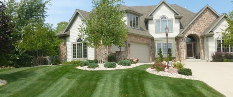 Retaining wall and terraced landscape beds.