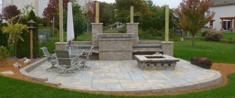 Finished landscape with layered beds and healthy turf.