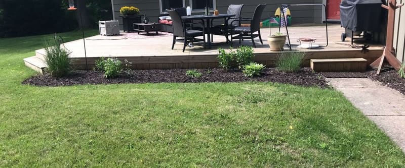 Freshly landscaped Southeastern Wisconsin property with a manicured lawn and clean beds.